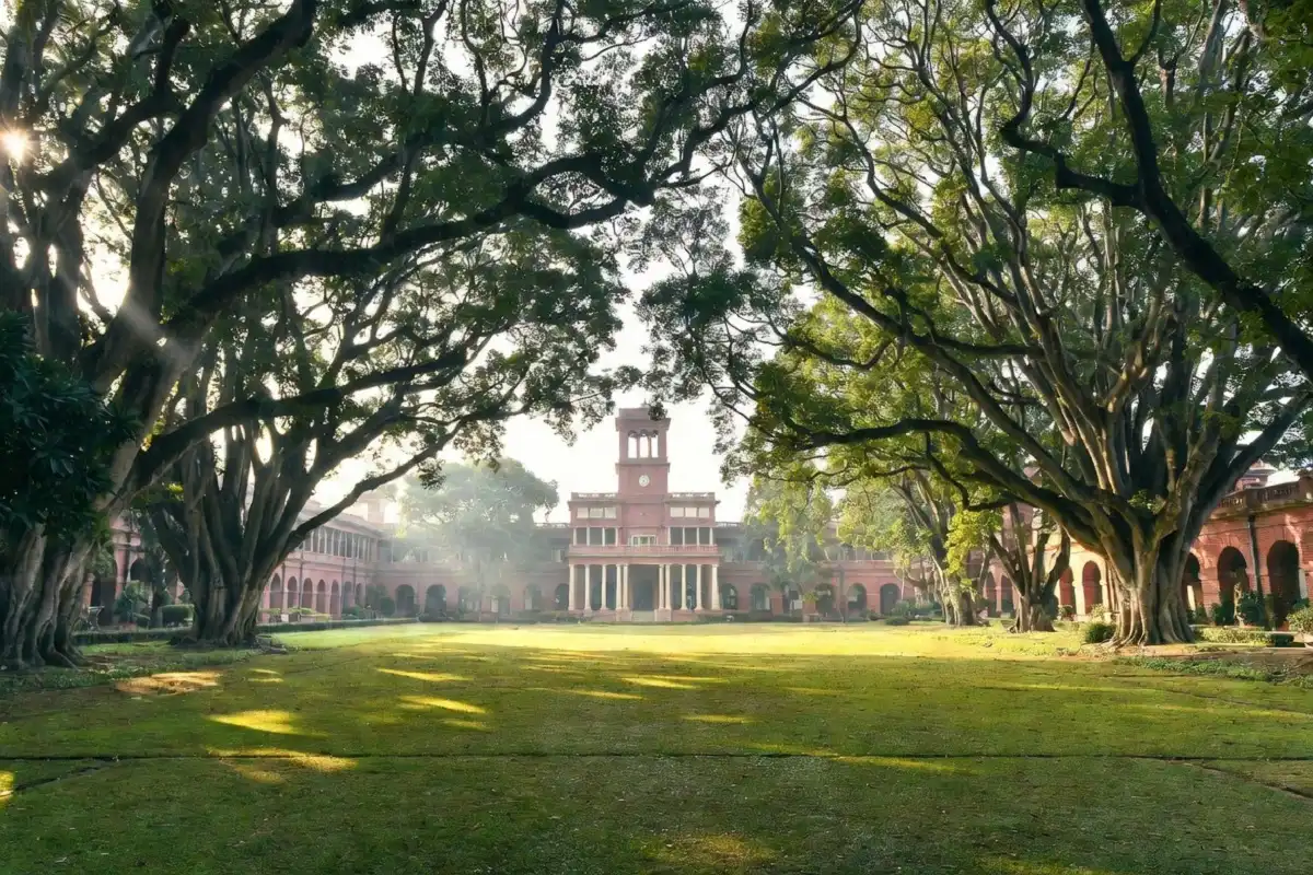 Forest Research Institute building surrounded by green trees in Dehradun