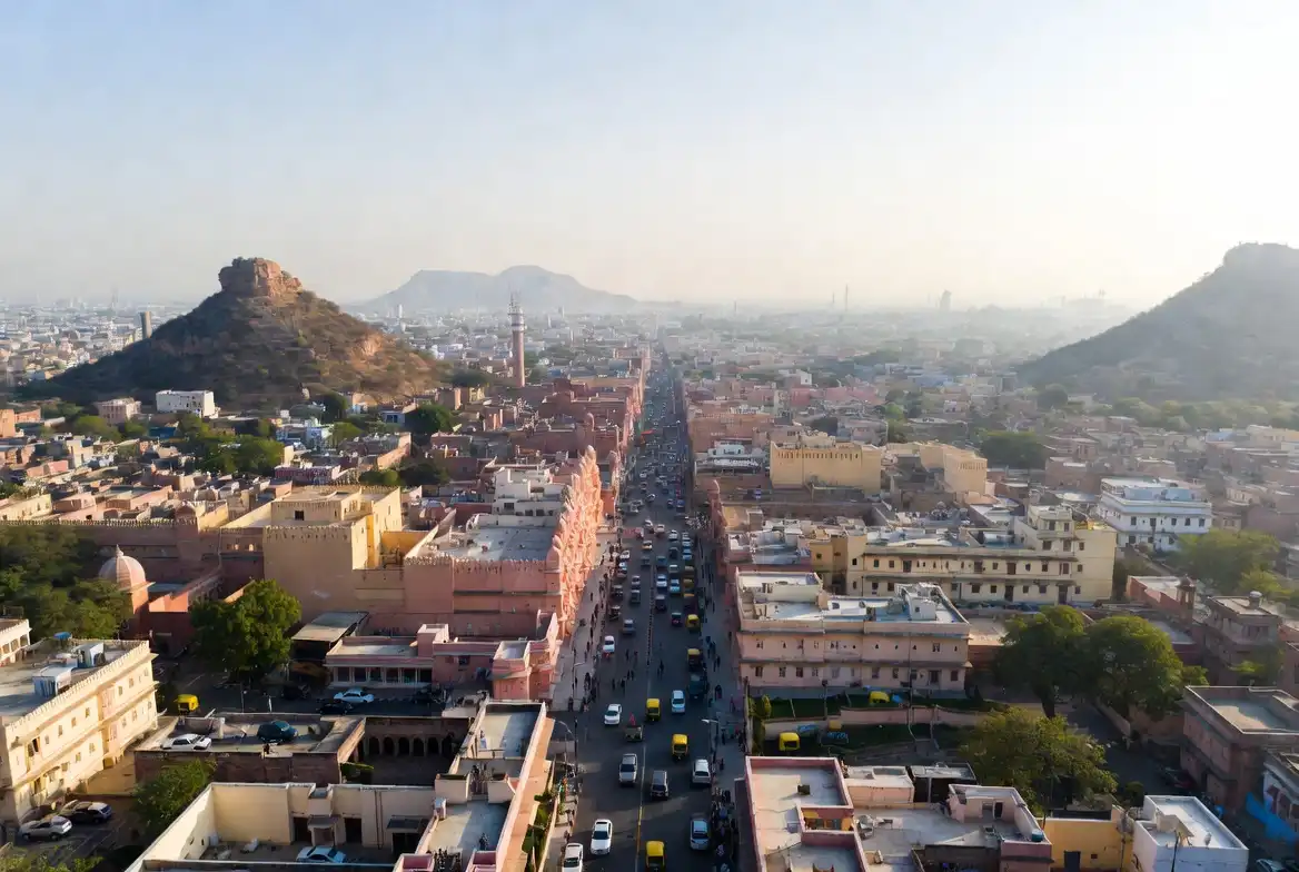 Aerial view of Jaipur News skyline with pink buildings and Aravalli hills