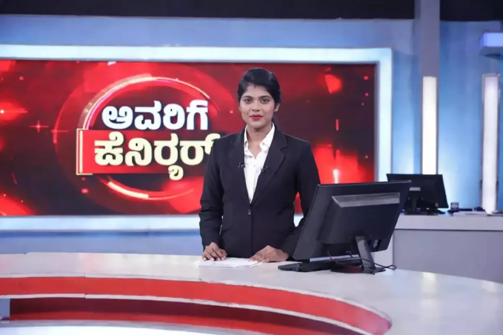 Kannada news anchor presenting breaking news live on Suvarna News channel